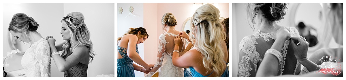 bridal party getting ready at the River Place in Knoxville Tennessee, bridesmaids are buttoning up the brides dress in the pink bridal room
