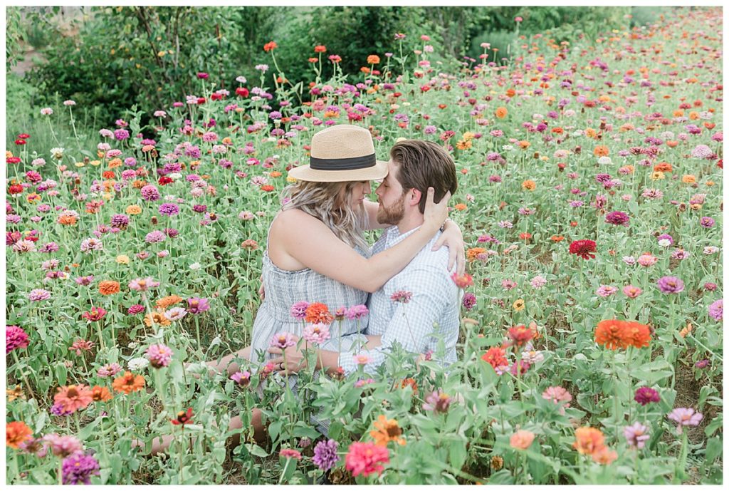 gorgeous couple sitting in the Tennessee wildflowers