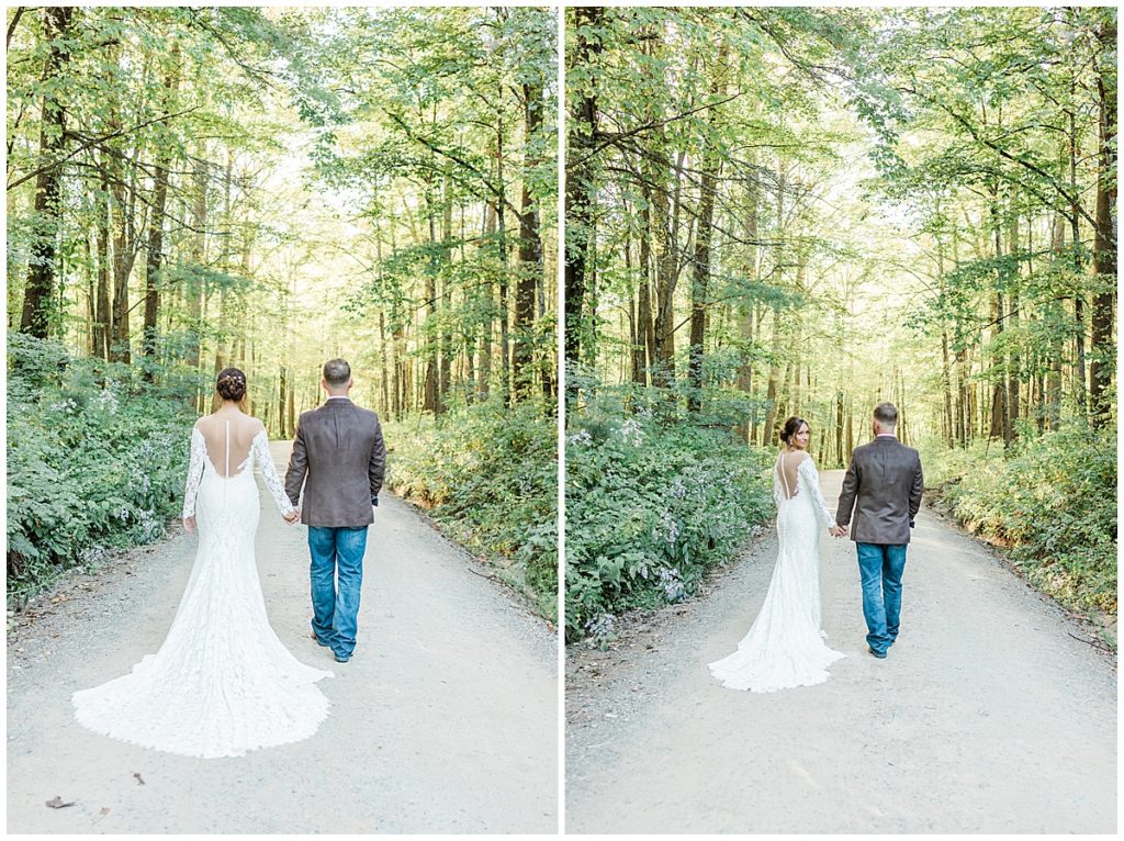 bride and groom standing in the middle of the gravel road in october