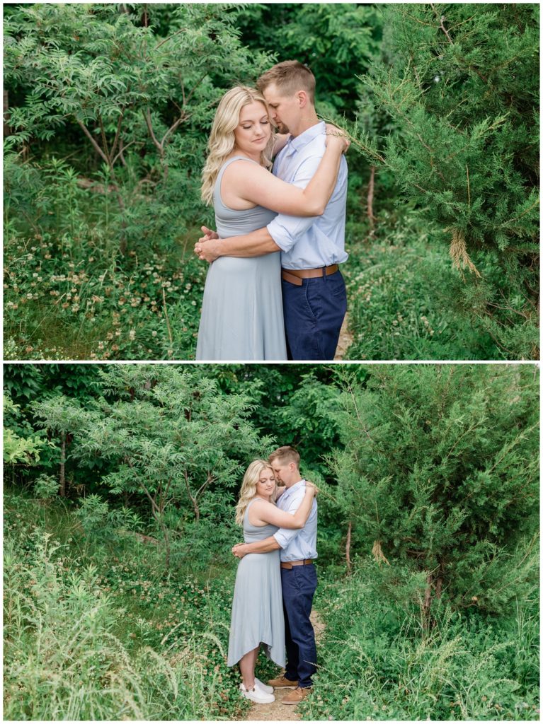 couple hugging in green lush forest of smoky mountains during smoky mountain anniversary sesion