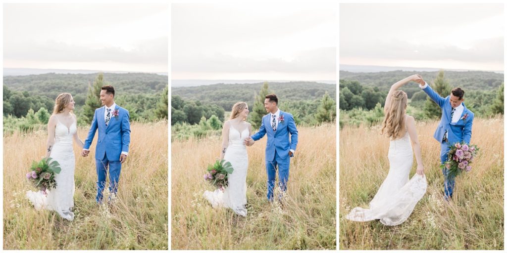 newlyweds dancing in a field