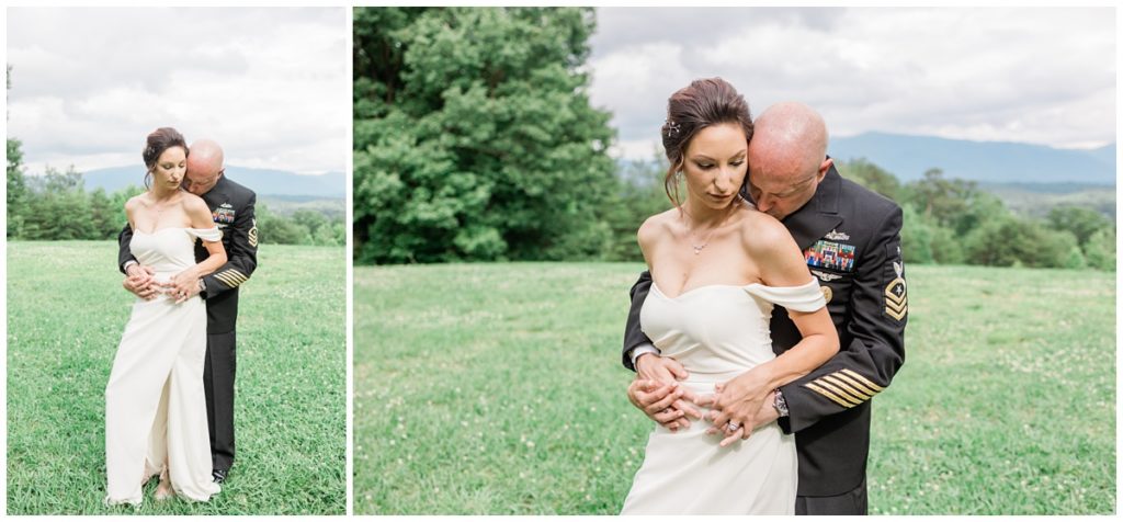 groom holding his bride by the hips and kissing her shoulder with the Smoky Mountains behind them
