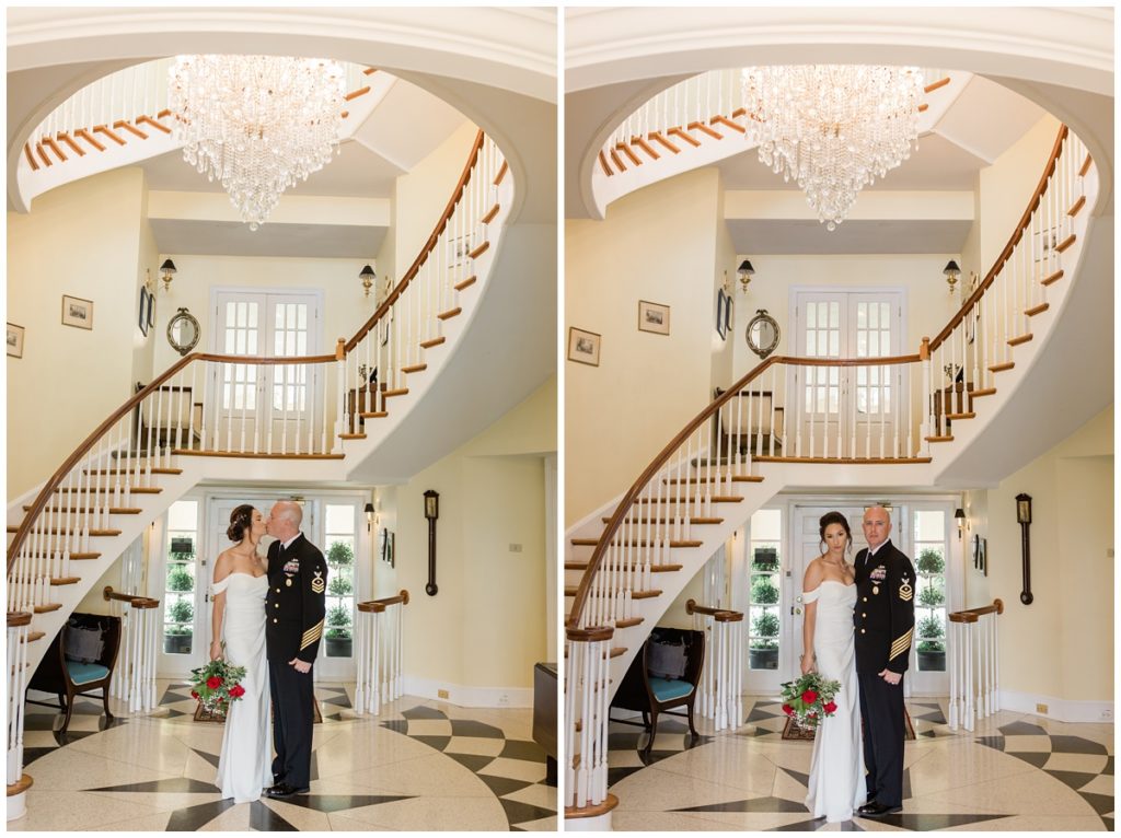 bride and groom in the Christopher Place's foyer standing under a huge chandelier on their wedding day with a grand stair case behind them for the most elegant wedding