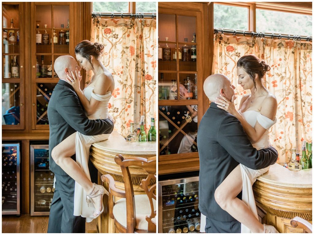 bride sitting on the edge of a bar while holding her husbands jaw as he holds her waist and they gaze into each others eyes so romantically at their Smoke Mountain elopement 