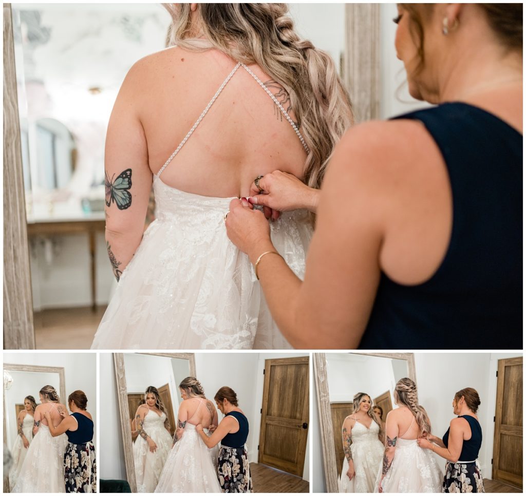 bride getting into wedding dress with her mother's help
