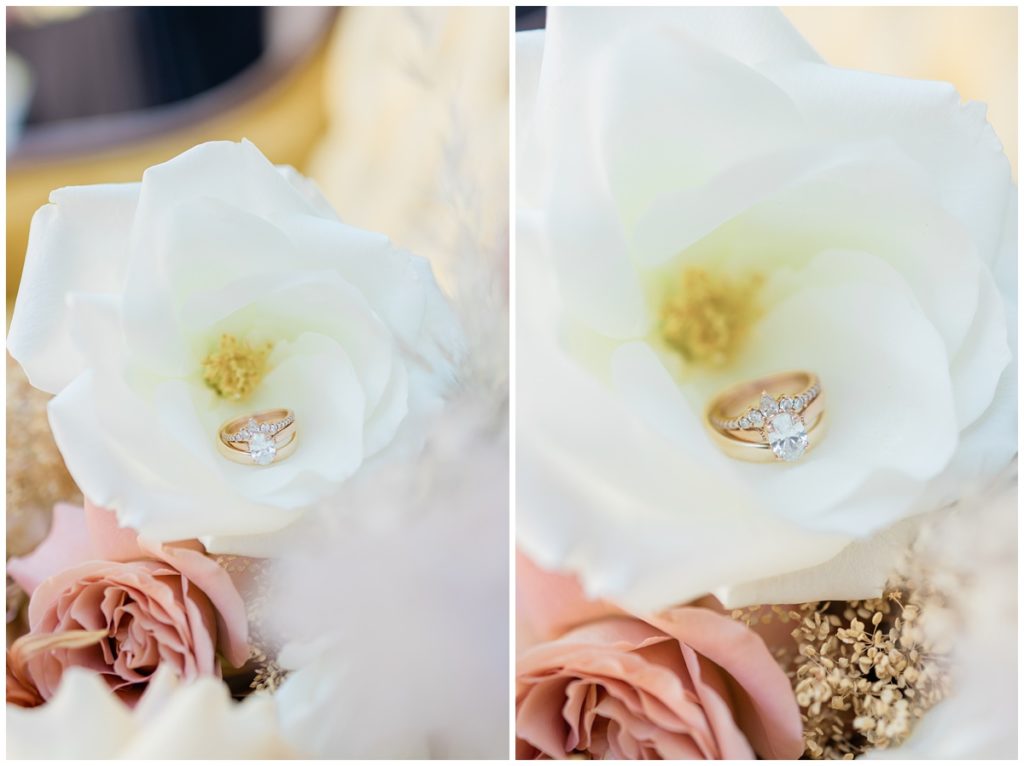 wedding rings in a white flower on bouquet