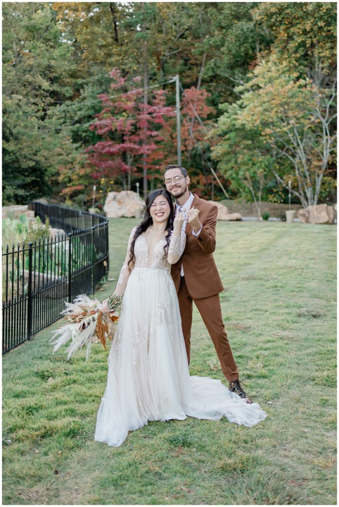 bride and groom showing their rings