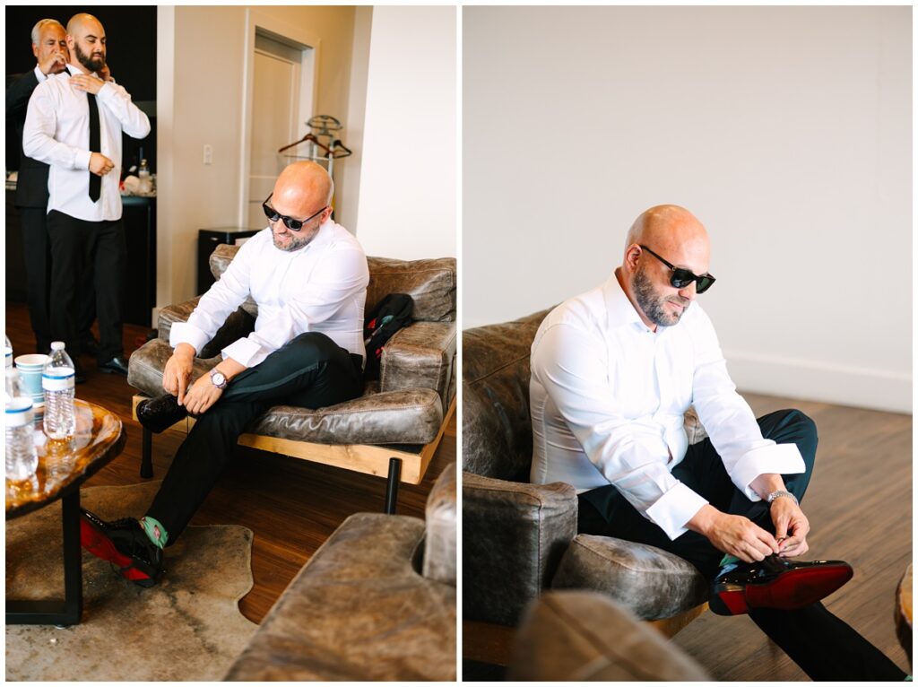 groom getting ready in the groom's suite at the trillium venue