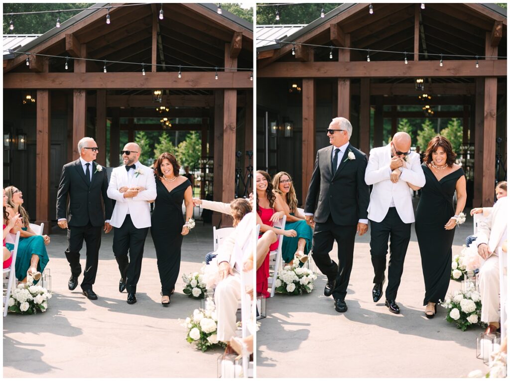 groom walking down the aisle with his parents