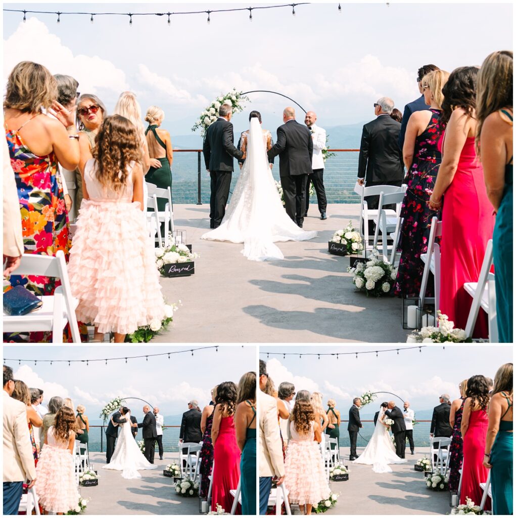 bride with dads at the end of the aisle from behind