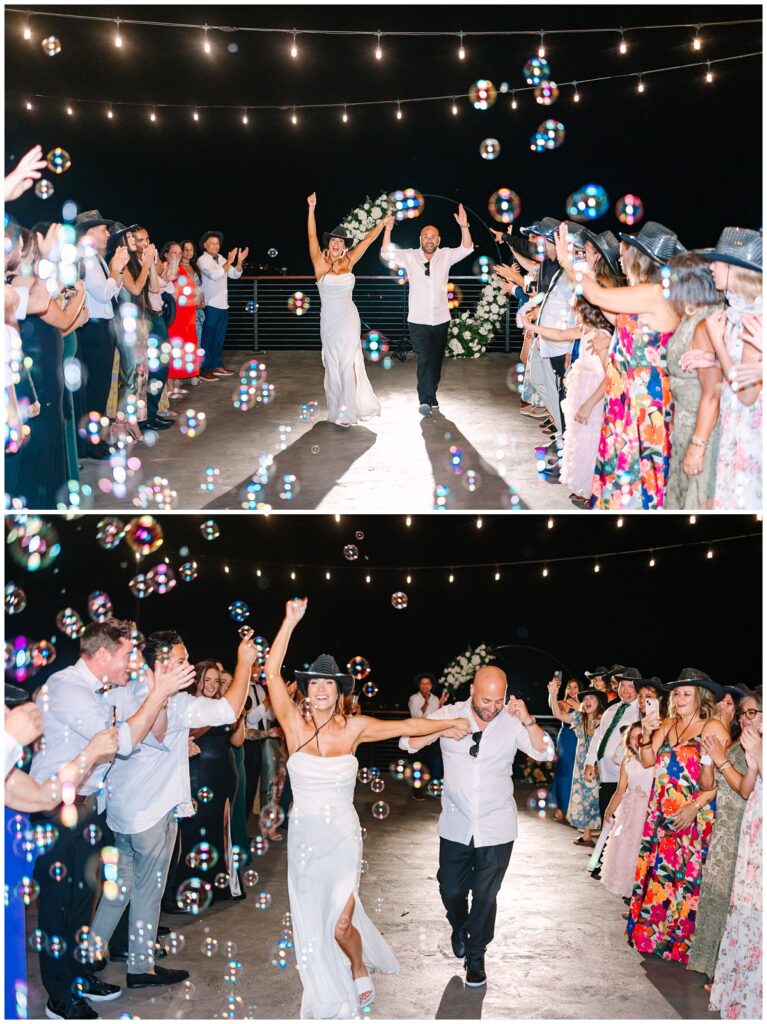 bride and groom running through a bubble exit from their wedding reception