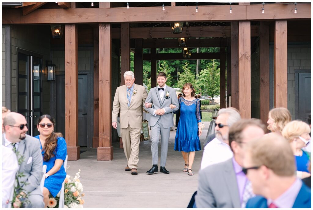 groom walking down the aisle