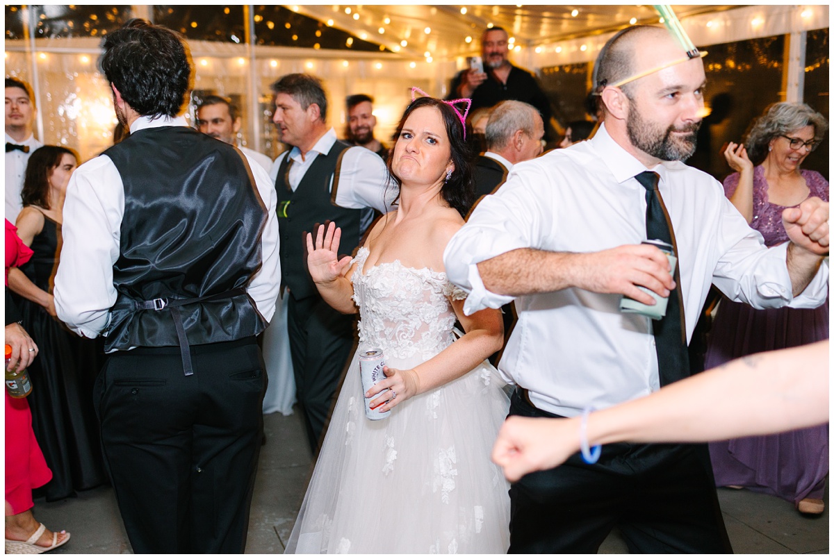 bride dancing at the reception with light up cat ears