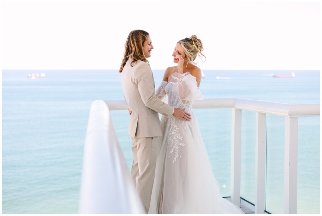 bride and groom first look on balcony