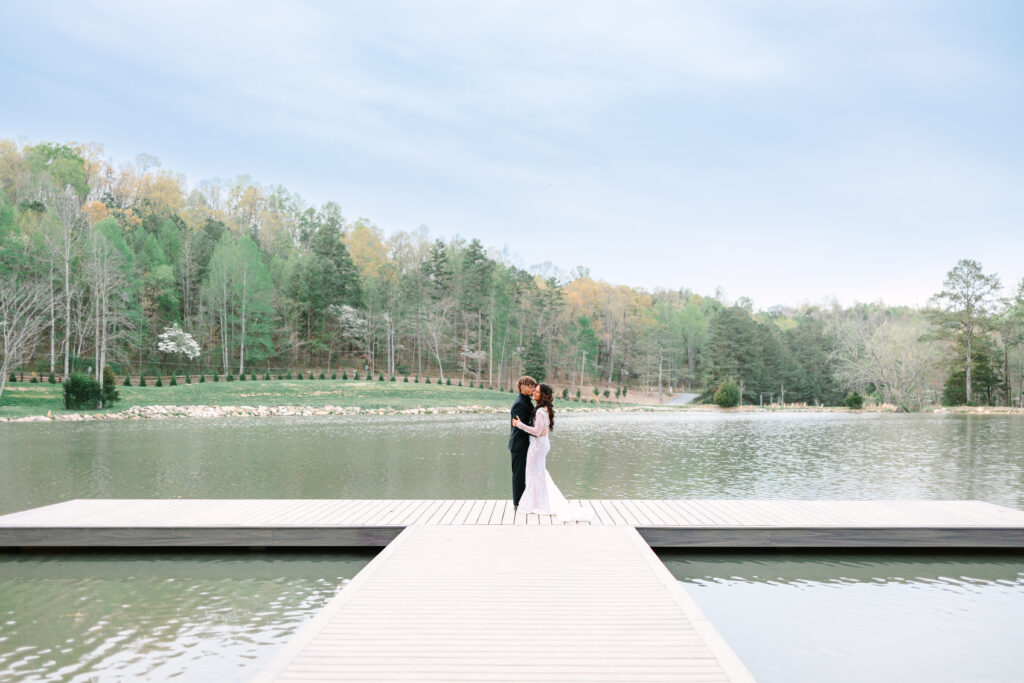 wedding couples portrait on the dock at hidden springs venue in apison, tennessee.