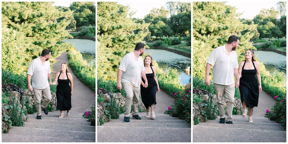 couple walking up the stairs at como zoo in front of the pond