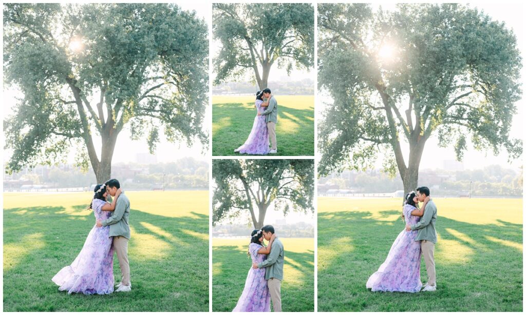 couple kissing and embracing in front of eastern cottonwood tree