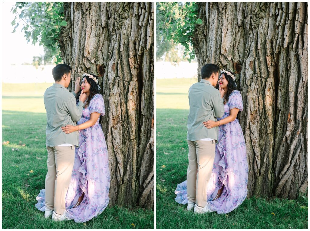 minnesota engaged couple leaning against eastern cottonwood tree in st. paul