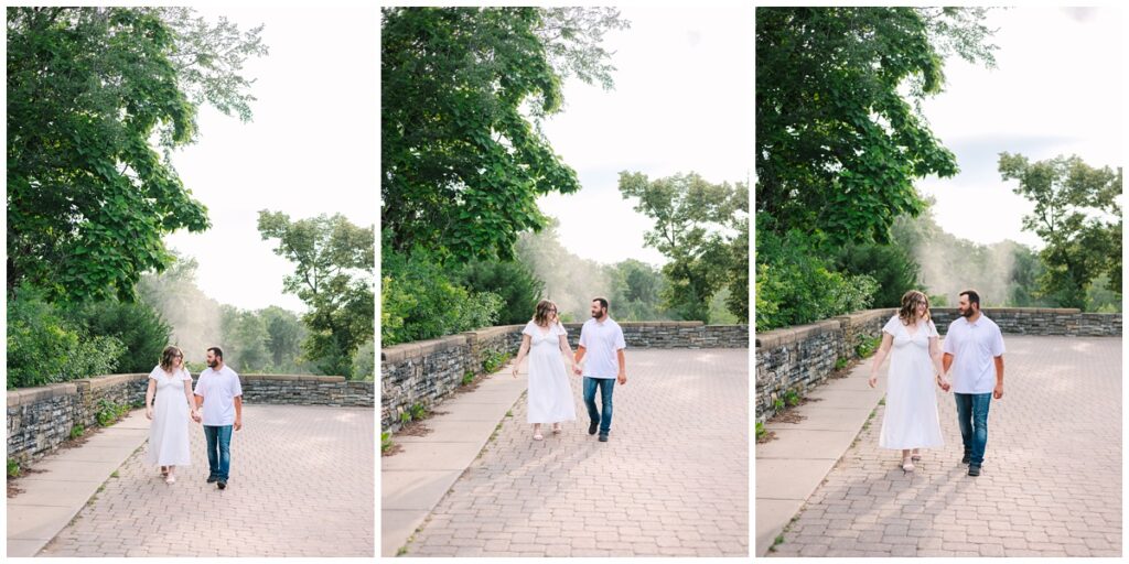 couple walking down cobblestone path