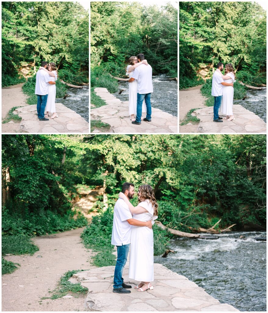 couple slow dancing together in front of a river in minnesota