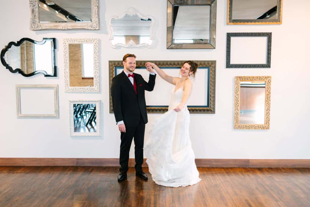 Olivia + Andrew Wedding Groom twirling the bride during wedding portraits