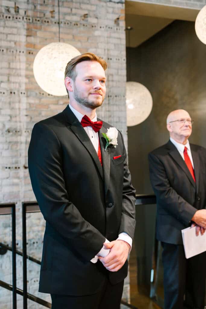 Olivia + Andrew Wedding Groom waiting with his father at the indoor wedding ceremony