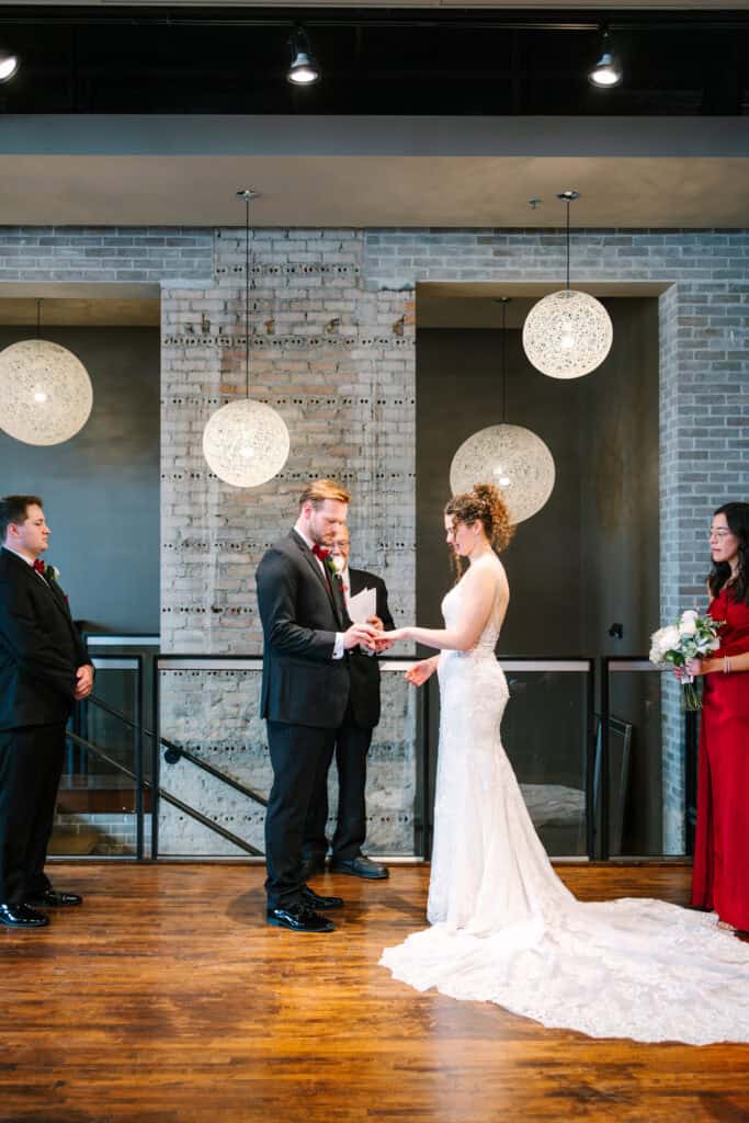 Olivia + Andrew Wedding Bride and groom exchanging vows at their FIVE Event Center wedding