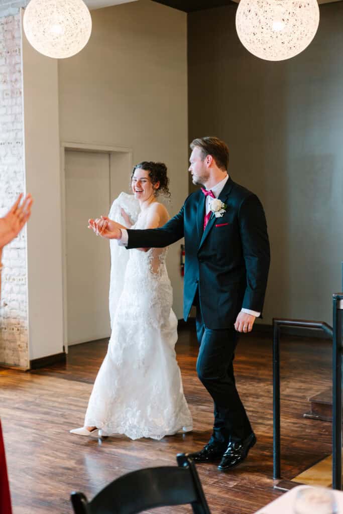 Olivia + Andrew Wedding Newlyweds beginning their reception entrance at FIVE Event Center