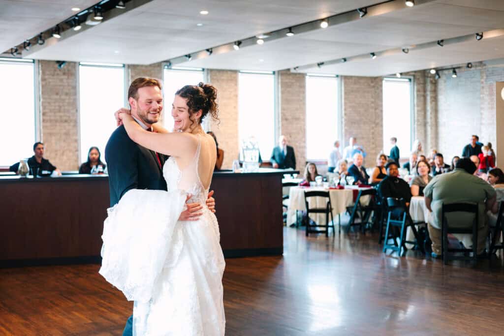 Olivia + Andrew Wedding Bride spinning across the dance floor during the wedding reception