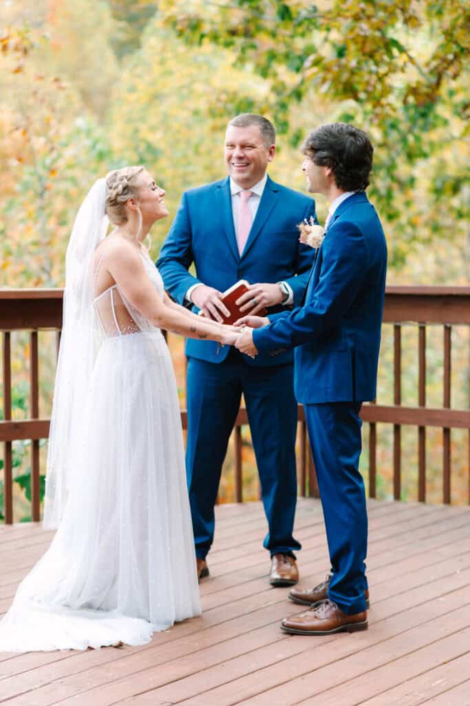 Bride and groom holding hands during their Smoky Mountain ceremony