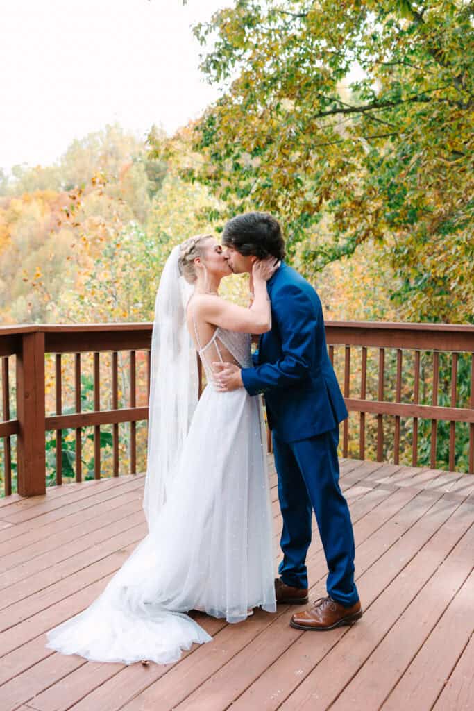 Bride and groom sharing their first kiss during the cabin deck ceremony