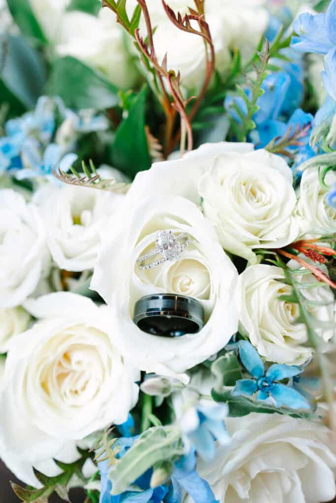 Lauren + Connor Wedding White rose bridal bouquet with soft blue flowers