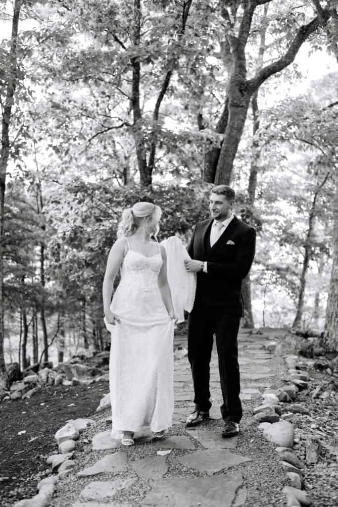 Lauren + Connor Wedding Black-and-white portrait of the couple among trees and rocks
