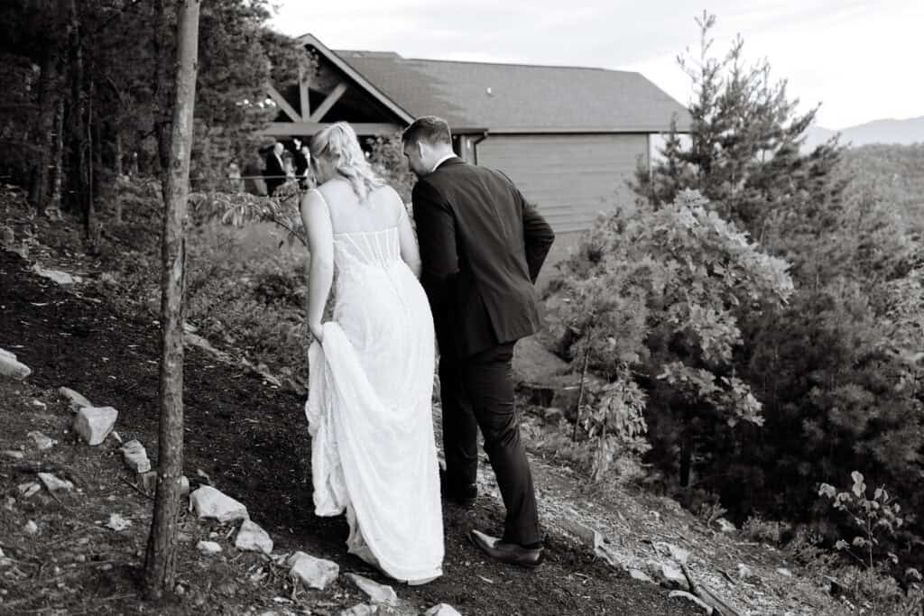Lauren + Connor Wedding Black-and-white portrait of the bride and groom embracing beside a tree