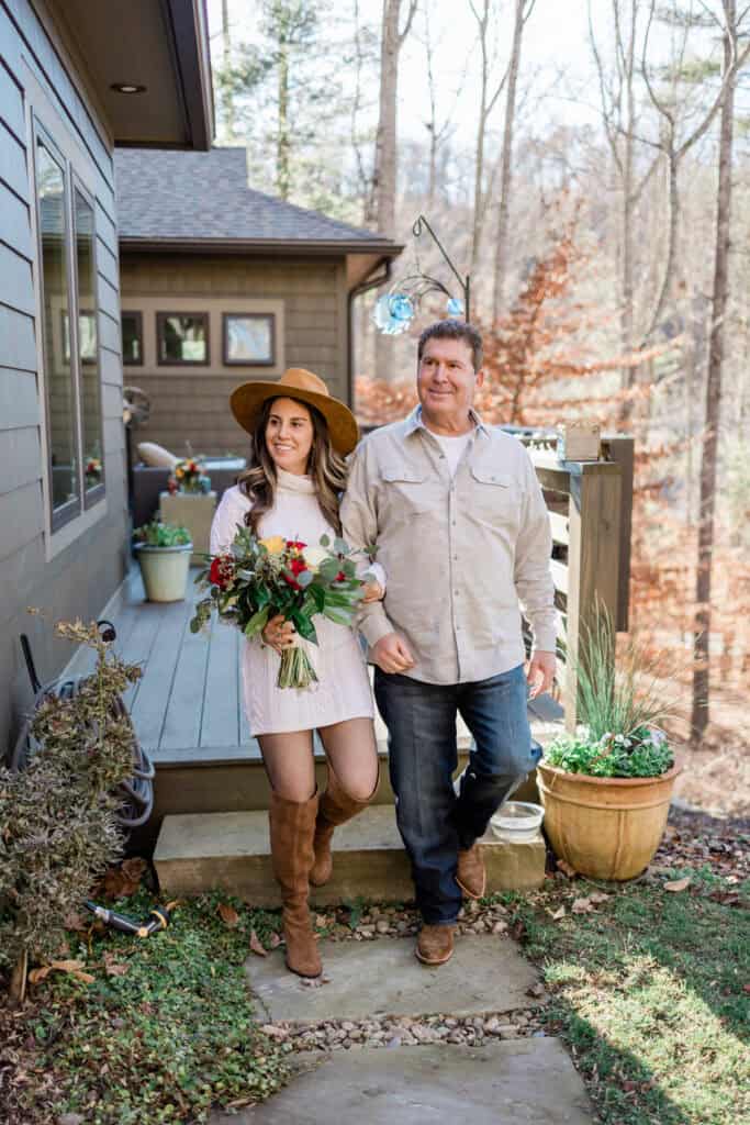 Laura + Steve Elopement Bride stepping out of the house with a loved one before the ceremony