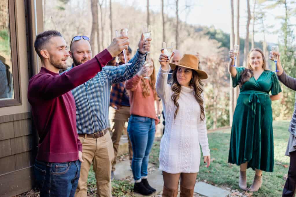 Laura + Steve Elopement Guests cheering with champagne after the elopement