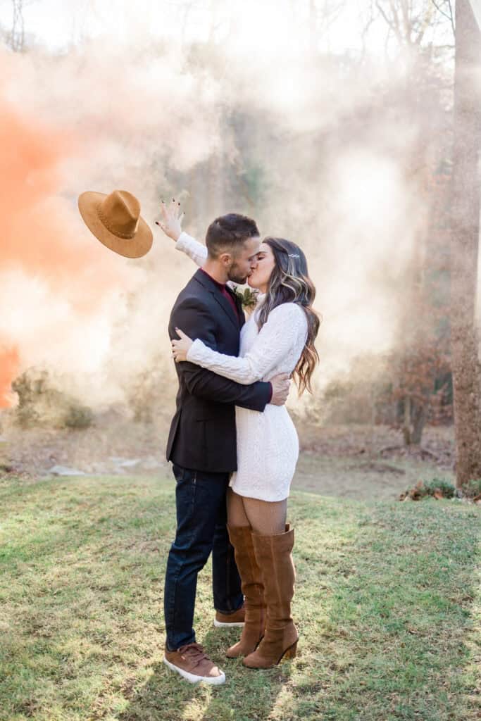 Laura + Steve Elopement Bride tossing her hat during a smoke bomb portrait