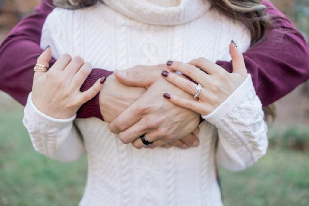 Laura + Steve Elopement Close view of the couple’s hands and wedding rings