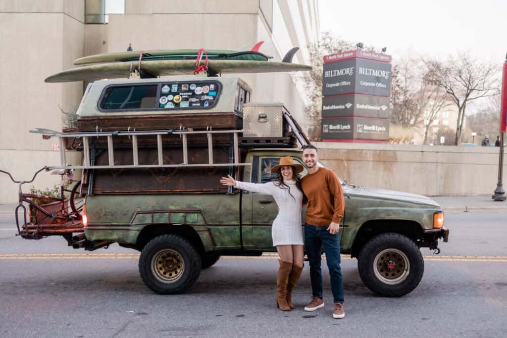 Laura + Steve Elopement Newlyweds next to a classic truck with surfboards on top