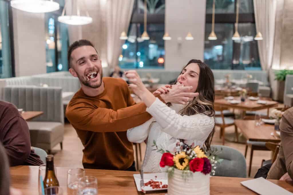 Laura + Steve Elopement Couple laughing together during their Asheville elopement dinner