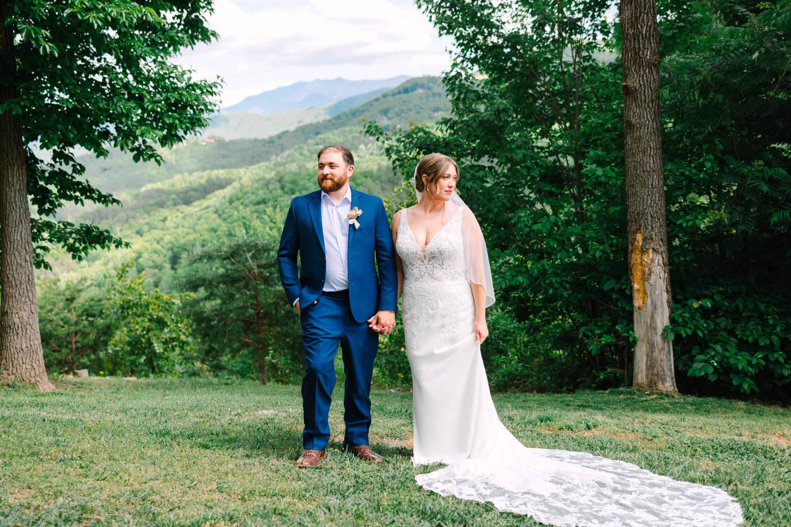 Bride and groom portrait at their Smoky Mountain destination wedding, framed by trees and mountain views
