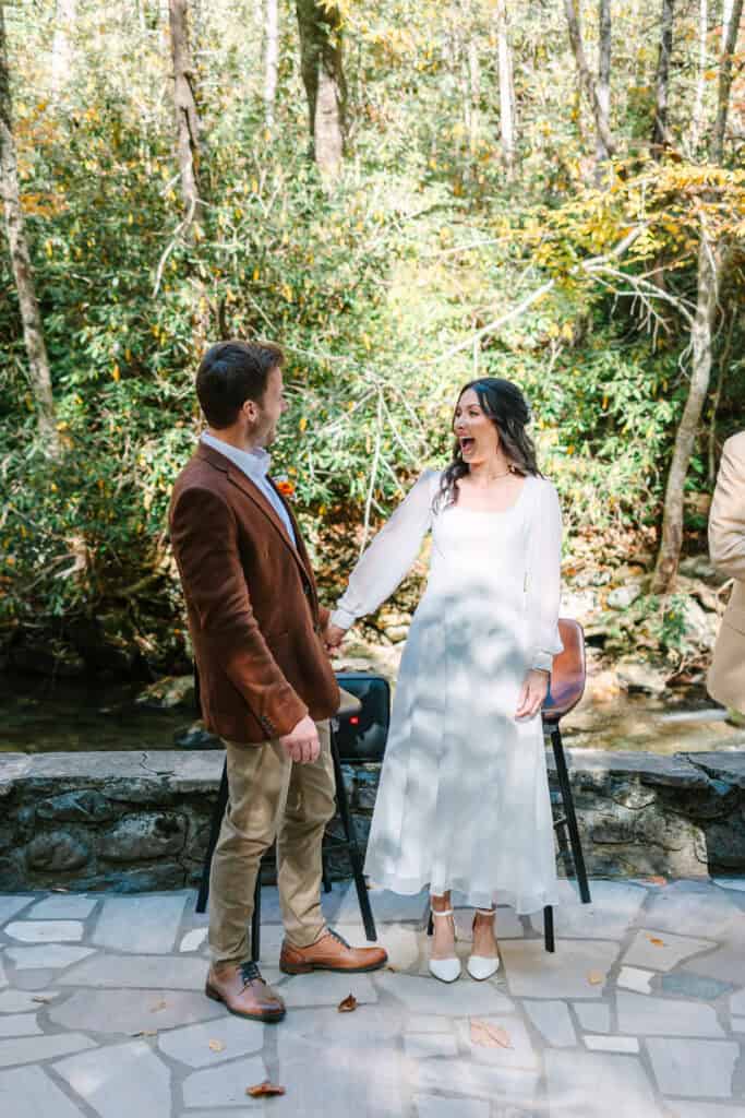 Thaís + Nick Wedding Bride and groom laughing together at the end of their ceremony