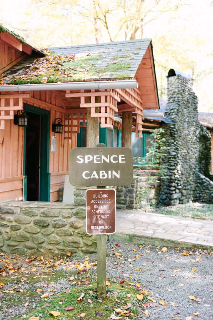 Thaís + Nick Wedding Spence Cabin sign in front of the historic cabin in the Elkmont Historic District