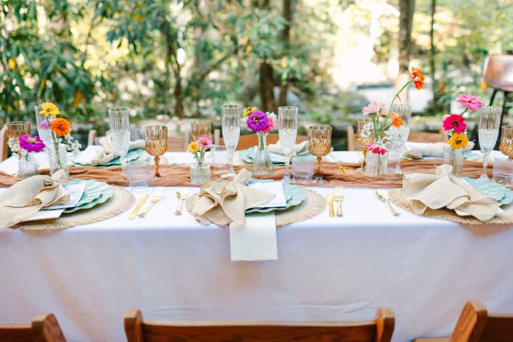 Thaís + Nick Wedding Reception table set for dinner outside Spence Cabin