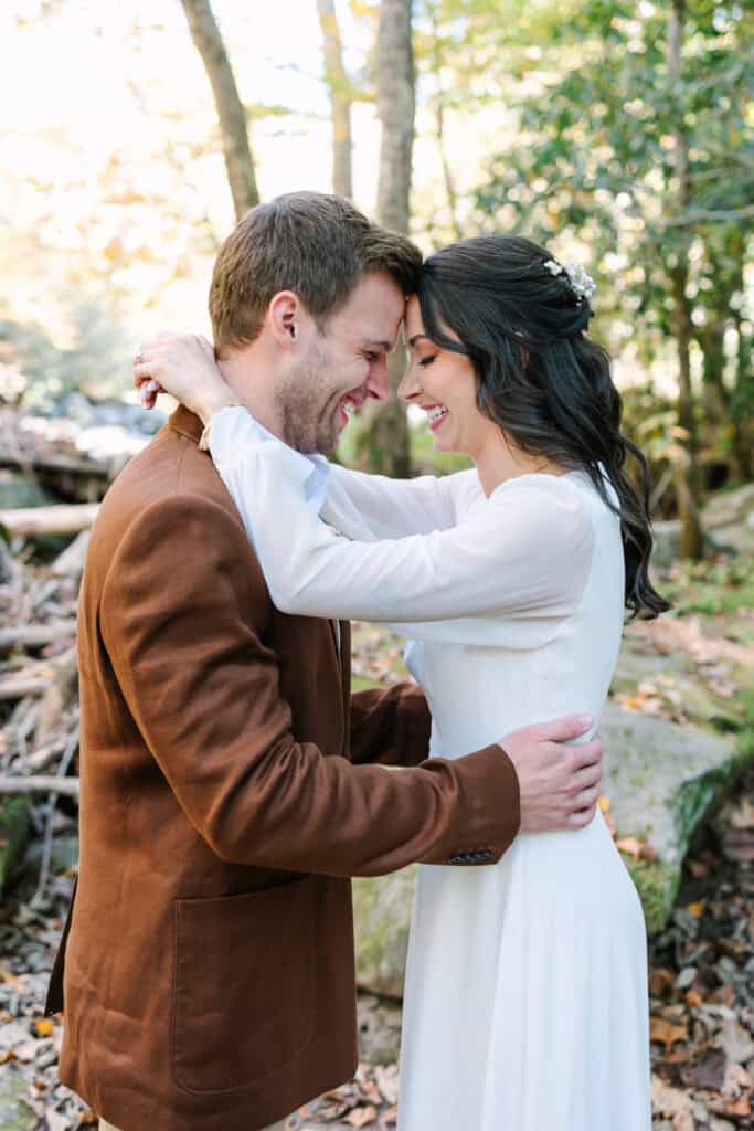 Thaís + Nick Wedding Groom resting his forehead against the bride in the forest
