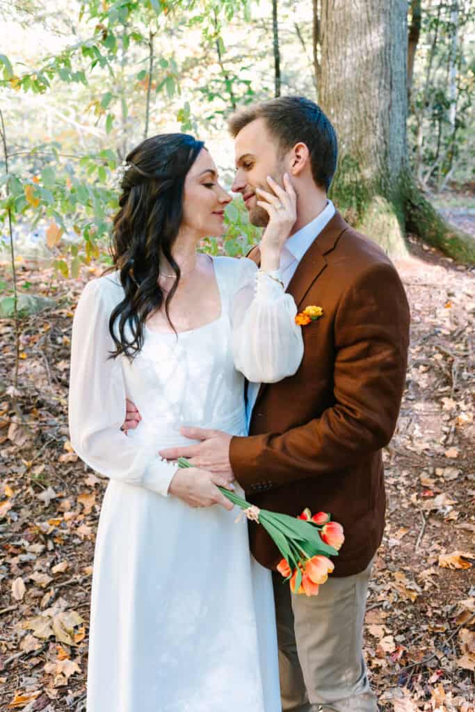 Thaís + Nick Wedding Bride and groom nose to nose in the autumn woods