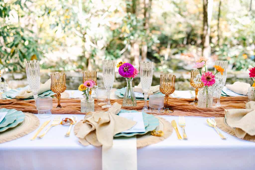 Thaís + Nick Wedding DIY tablescape with bud vases and terracotta linens