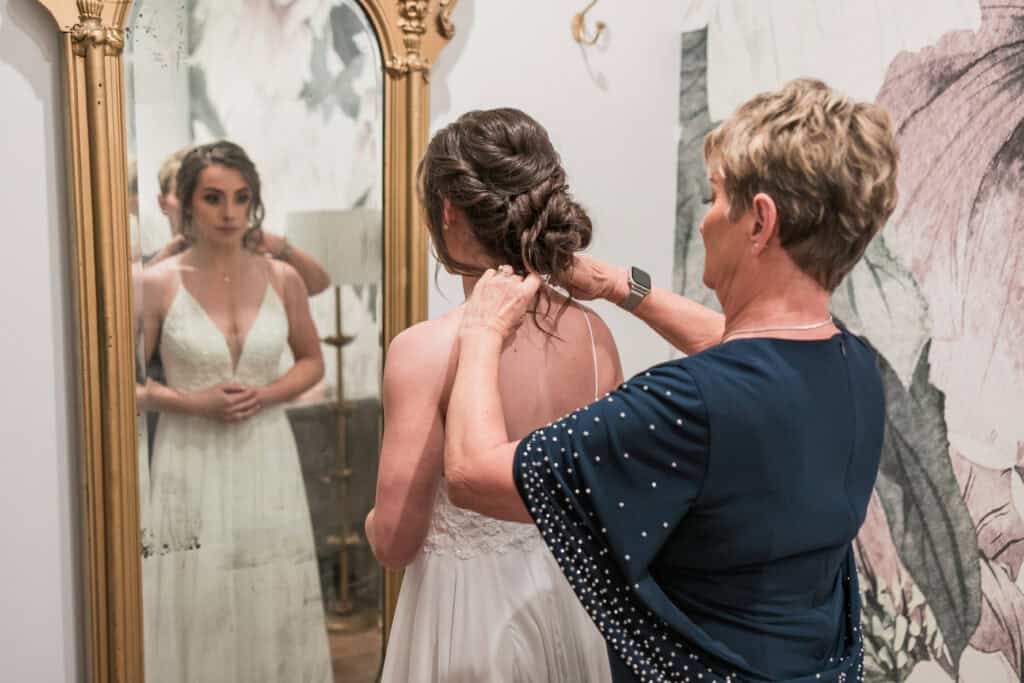 Sarah + Jake Wedding Bride and her mom sharing a moment before the brunch wedding