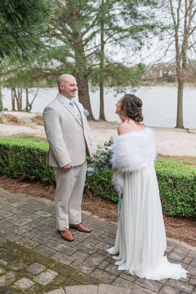 Sarah + Jake Wedding Groom waiting on the brick path for the first look