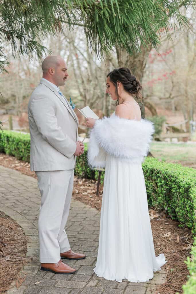 Sarah + Jake Wedding Groom holding the bride’s hands after the first look